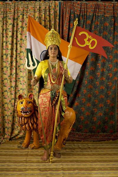 Motherland: Studio Photograph with Flag, Trishool and Om, 2009 - Pushpamala N